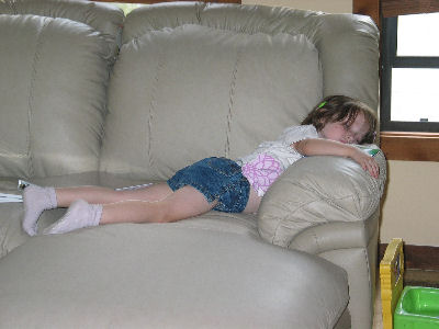 Tessa asleep on couch